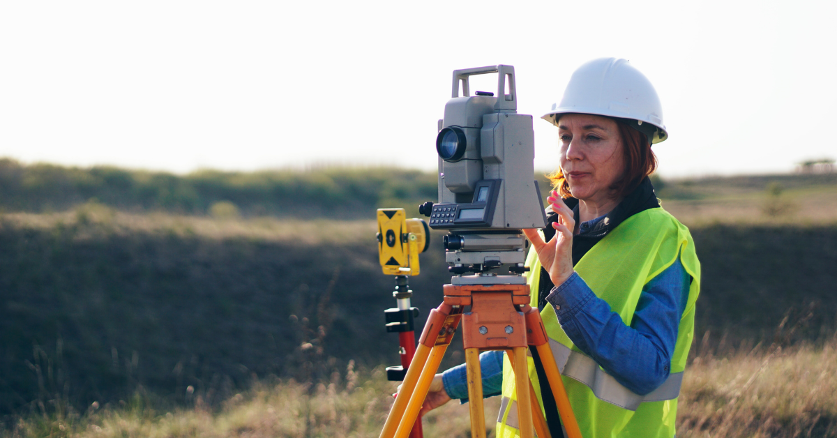 professional surveyor using advanced equipment
